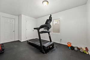 Bedroom/Workout room with baseboards