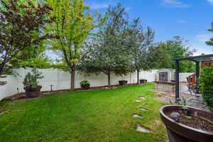 View of yard with a storage shed and an outbuilding