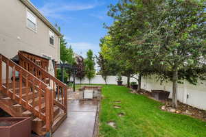 View of yard with a patio