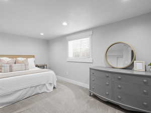 Carpeted bedroom featuring baseboards and recessed lighting