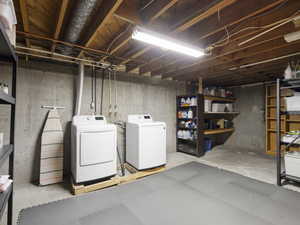 Unfinished basement with washing machine and dryer