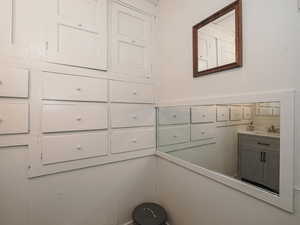 Unit 1 main floor bathroom with individual drawers and cabinets