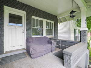 Covered porch with front basement entrance