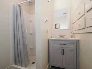 Unit 1 main floor bathroom with individual drawers and cabinets