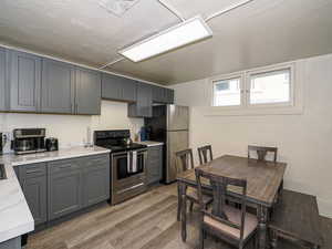 Unit 2 kitchen includes table and kitchen items