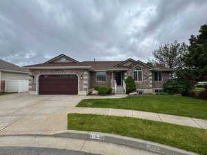 Ranch-style house with driveway, an attached garage, brick siding, and roof with shingles