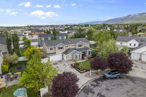 Aerial perspective of suburban area featuring a mountainous background