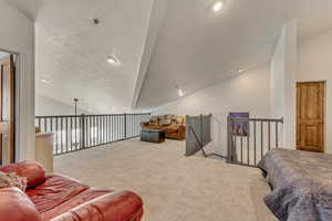 Open 25' x 23' Newly Carpeted Loft Living area with sufficient space for a ping-pong table.