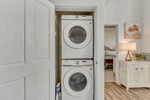 Main Level Laundry with stacked new washer/dryer.