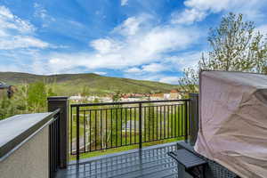 Balcony overlooking Glenwild Trails with Park City mountain views.