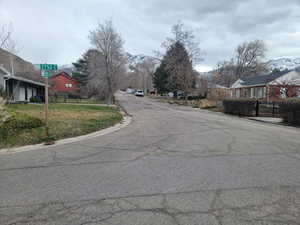 View of asphalt street featuring a residential view