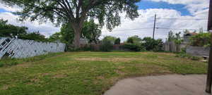 View of yard with fence