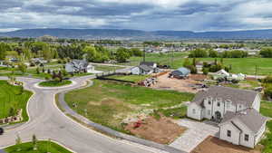 Aerial view of residential area featuring a mountain backdrop