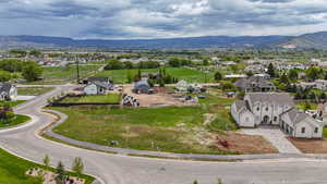 Aerial view of residential area featuring a mountainous background