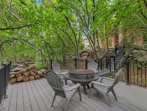 Deck with a fire pit and stairway