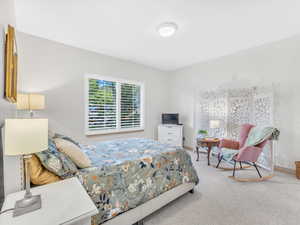 Bedroom with carpet and baseboards