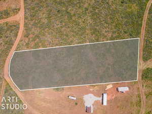 Aerial view of property and surrounding area featuring property boundaries highlighted