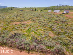 View of yard featuring a rural view and an outdoor structure