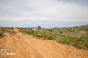 View of road with a mountain view and a view of rural / pastoral area