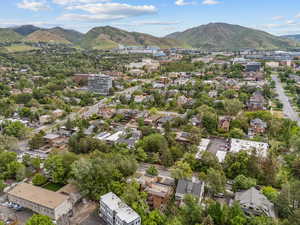 Aerial view of property's location featuring a mountainous background