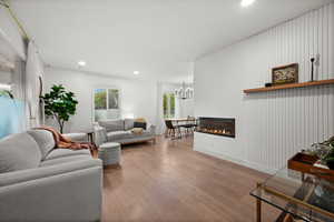 Gorgeous Living Room w/ fireplace and custom accent wall.