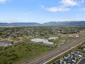 Aerial view of residential area featuring a water and mountain view
