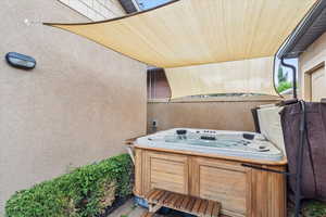 View of patio featuring a hot tub