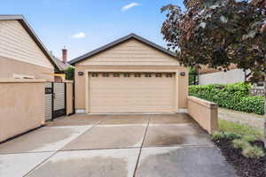 Detached garage featuring a gate