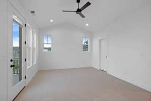 Unfurnished room featuring a ceiling fan, vaulted ceiling, recessed lighting, light carpet, and baseboards