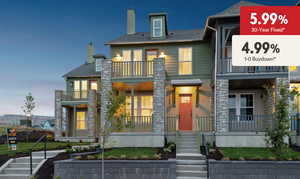 View of front of home featuring a balcony, a porch, and a chimney