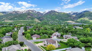 Aerial perspective of suburban area with a mountain backdrop