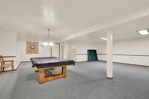 Game room featuring carpet, baseboards, and pool table