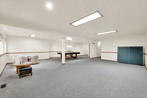 Recreation room with carpet flooring, baseboards, and billiards