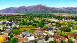 Aerial view of residential area featuring mountains