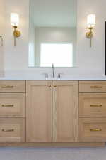 Bathroom with a sink and tile patterned flooring