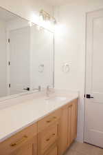 Bathroom with vanity and tile patterned floors