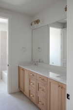 Full bath featuring double vanity, tile patterned flooring, a bath, and a shower