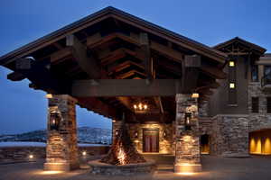 View of property with an outdoor fire pit