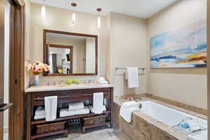 Bathroom with a bath and double vanity