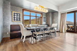 Dining room with wood finished floors and baseboards