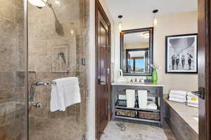 Full bathroom with a shower stall and vanity