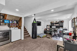 Carpeted office space with washer / dryer and recessed lighting