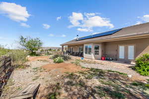 Fenced yard with french doors and a patio area
