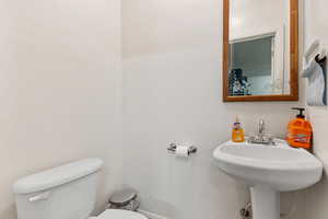 Bathroom with toilet and a sink