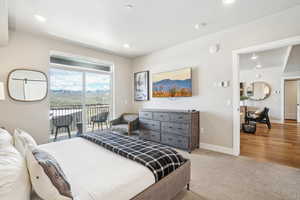 Bedroom with access to exterior, baseboards, recessed lighting, and carpet floors