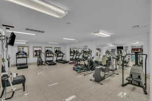 Gym featuring tile patterned floors