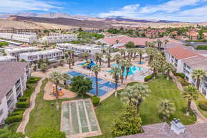 Aerial view of a mountain backdrop and a pool area
