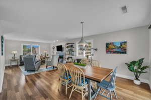 Dining area with wood finished floors and baseboards