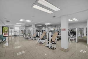 Gym featuring light tile patterned flooring