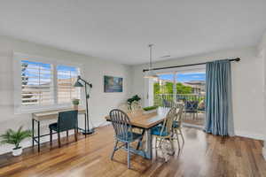 Dining area with wood finished floors and baseboards